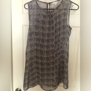 Women’s sleeveless semi-sheer small CAbi blouse. Tunic length.